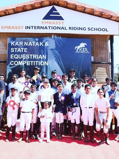 A group photo of all the competitors at the Karnataka State Equestrian Competition, hosted at my school. It's a day of skill, speed, and elegance.