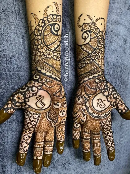 Created for my lovely niece, who shares my love for mehendi and BTS. This design features her and her partner's initials along with a subtle K-pop heart symbol.