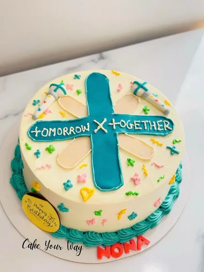 A minimalist cake for a fan of the K-pop group Tomorrow X Together (TXT), perfect for a smaller celebration.