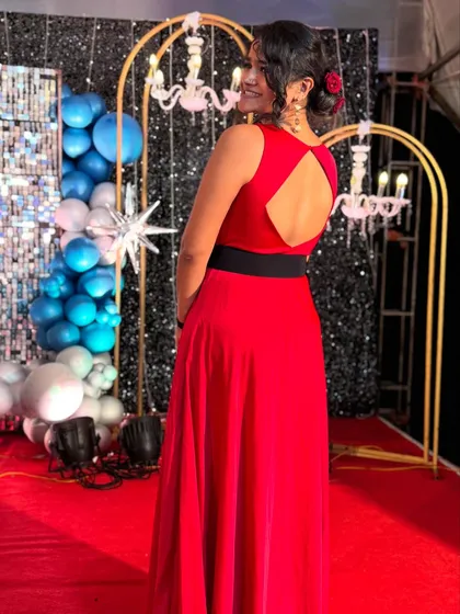 Modeling this elegant red gown, or 'Laal Pari' as I call it. This look is perfect for evening wear, showcasing a sophisticated and glamorous style for event and fashion modeling.