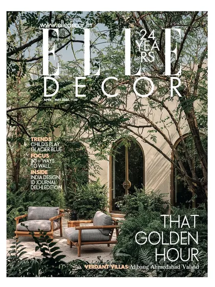 The cover of Elle Decor's April-May issue, featuring the lush garden and inviting arches of our Dua Villa project in Alibaug.