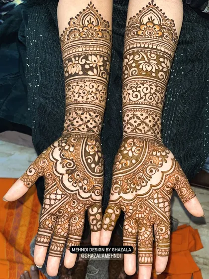 A full-hand design with bands of different traditional patterns.