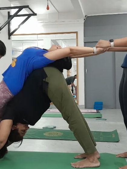 This three-person backbend variation is a beautiful example of how we use teamwork to explore advanced postures safely and effectively.