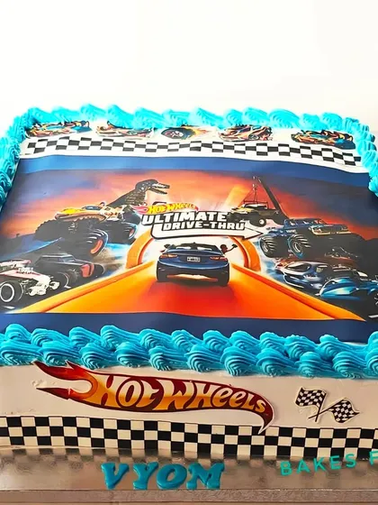 A large, rectangular Hot Wheels cake with an edible image of a race track. This is a great option for serving a larger party while sticking to the theme.