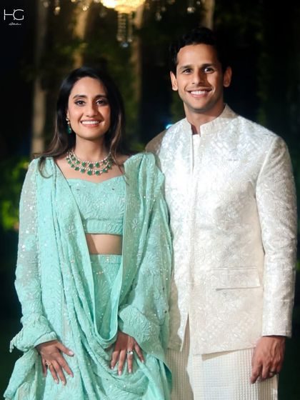 An all-cream look exudes timeless sophistication. This custom bandhgala features subtle self-embroidery, creating a rich texture that is perfect for a day or evening wedding ceremony.