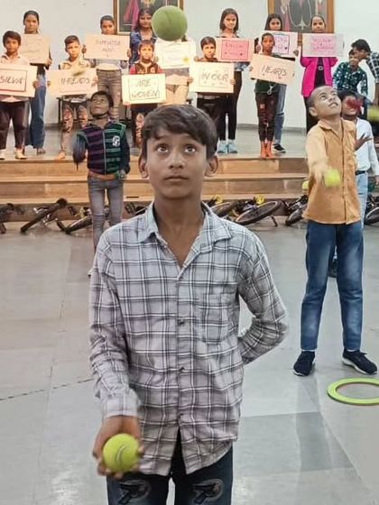 A young participant focused on mastering the art of juggling. These sessions are not just fun; they help build confidence and coordination. We love seeing kids challenge themselves and learn new things.