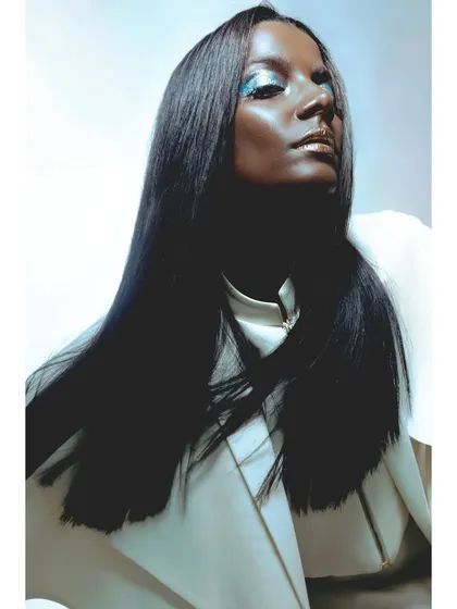 Another angle of the futuristic portrait. The lighting highlights the sleek hair and the sharp lines of the white coat, creating a polished, high-fashion look.