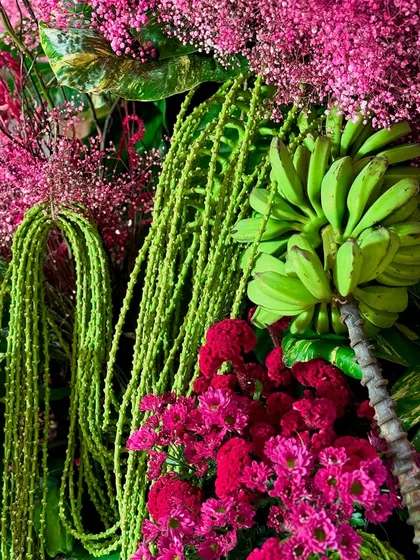 The beauty is always in the details. This close up highlights the vibrant contrast between fuchsia celosia, delicate pink blooms, and the unexpected texture of unripe bananas, showcasing how I layer natural elements to create a rich, artistic composition.