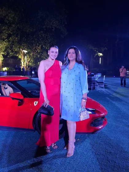At the Ferrari launch event with a friend. My styling services can also extend to coordinating looks for couples or friends attending an event together.