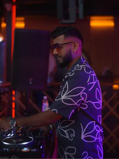 Deep in concentration, crafting the perfect mix for the dance floor.