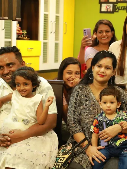 The happy faces of a family enjoying the puppet show. It's all about creating joyful memories.