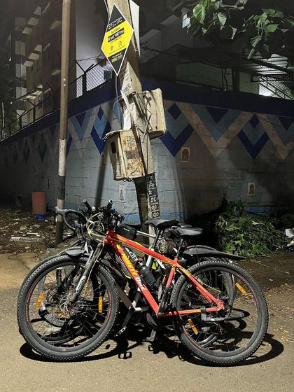 Our bikes parked against a painted wall during a ride through Thippasandra. We are always on the lookout for interesting backdrops for our cycle stacks.