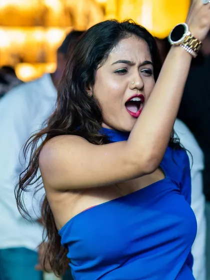 The ultimate goal is seeing pure joy on the dance floor. This candid shot captures a guest lost in the music during one of my sets, which is the best feedback a DJ can get.