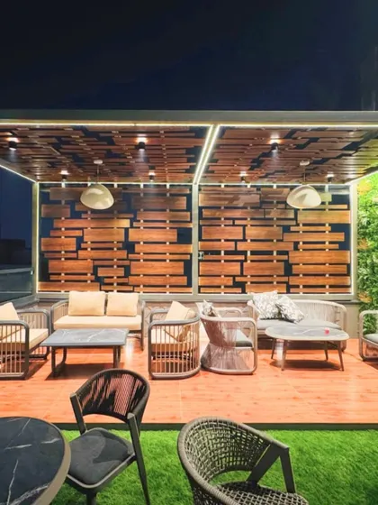 I transform outdoor areas into functional and stylish extensions of the home. This rooftop terrace features a custom wooden pergola, comfortable all-weather seating, and a vertical garden wall, creating a perfect urban oasis for relaxing or entertaining.