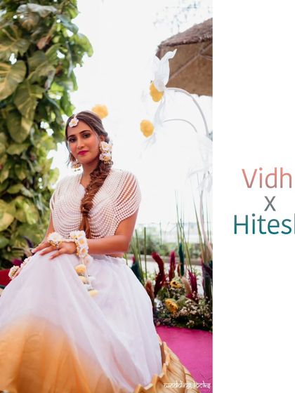 A stunning portrait of the bride at her Haldi, adorned with beautiful floral jewelry and ready for the festivities.