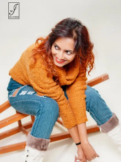 A joyful and candid moment captured in the studio, showing the model's bright personality.