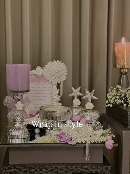 A full view of our lavender and silver themed hamper. It includes candle stands, decorative jars, and a personalized frame, all tied together with beautiful floral arrangements for a cohesive look.