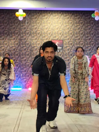 Here I am, Rahul, leading a workshop and breaking down the steps for our enthusiastic students. My goal in every class is to make sure everyone is learning, smiling, and feeling the music.