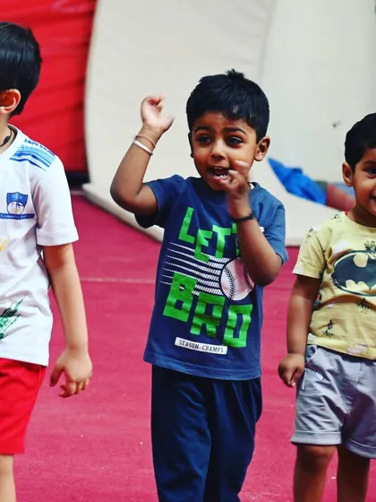 The excitement is real. These young boys are ready for their next fun activity, showcasing the energy of our toddler gymnastics program.