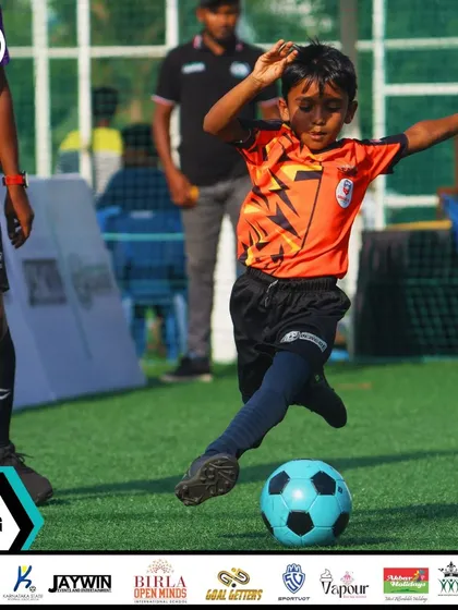 A young player takes a shot on goal, demonstrating the confidence and skill we build in our youngest age groups.