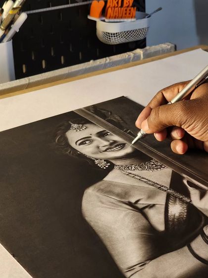 My hand working on the intricate details of the portrait.