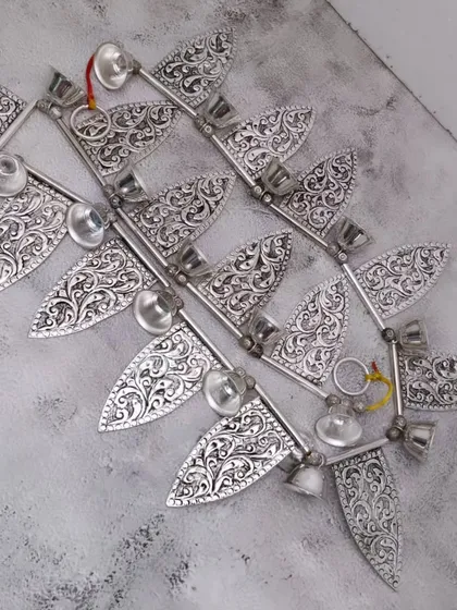 A full view of the antique German silver door toran, a beautiful decorative piece for the entrance of your home or pooja room.