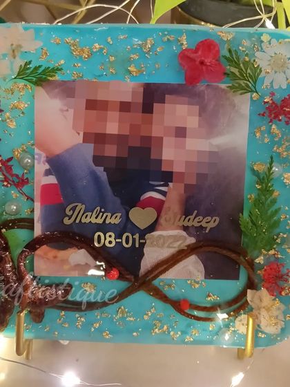 The thali rope is such a sacred part of a wedding ceremony. I preserved it here in this custom resin photo frame, creating an infinity symbol to represent everlasting love.