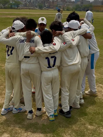 A close-up of the team huddle. Every player is focused and listening.
