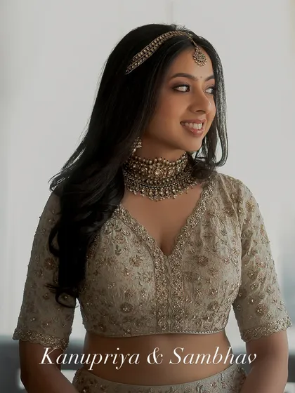 A close-up of the bride, Kanupriya. Her soft makeup and antique-finish jewelry create a look that feels both personal and timeless.