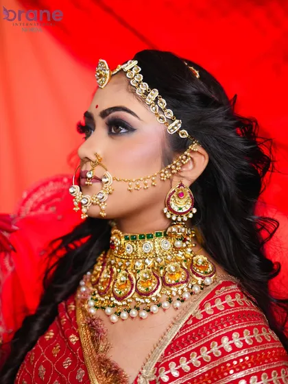 A close-up on the Padmavati-inspired look, focusing on the elaborate jewelry like the choker and matha patti, and the dramatic eye makeup.