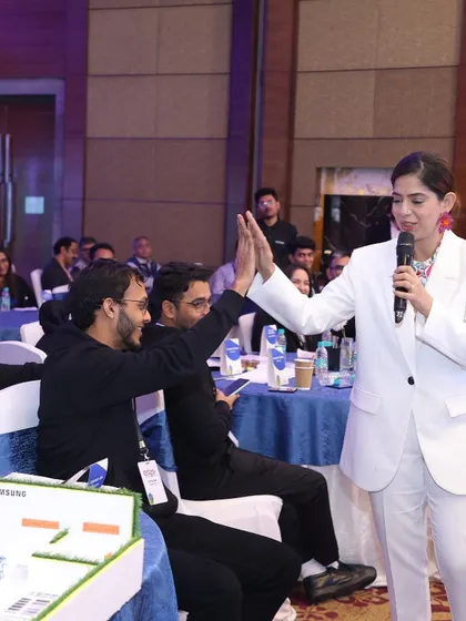 Giving a high-five to a participant at Samsung EDGE. Building rapport and making the experience fun is a huge part of my job.