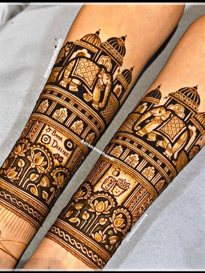 A mesmerizing bridal design featuring royal elephants, grand palaces, and beautiful peacocks. The arms also include fun, personalized elements like a "Bira" logo and a cute fries and drink motif.