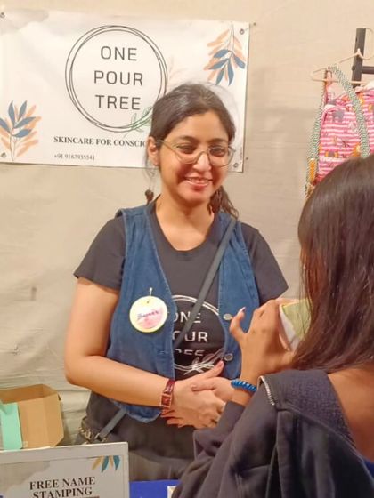 A candid moment of me chatting with a customer at the Golden Spiral Fair. Answering your questions and helping you find the perfect product for your skin is one of my favorite things to do.