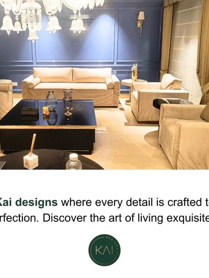 This overhead view captures a living room we designed, showcasing a harmonious layout. The space features plush, neutral-toned sofas and armchairs, centered around a dark coffee table, creating an inviting area for conversation and relaxation.