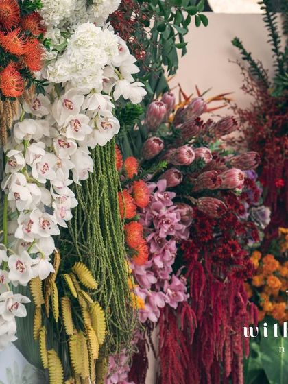 A vibrant mix of cascading flowers from the 'Garden of Gaia' wall, showcasing a rainbow of colors.
