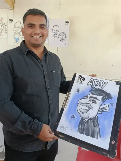 A guest named Ajay with his cool caricature. The blue background makes the drawing pop.