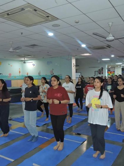 The yoga session includes light cardio and warm-up exercises to prepare the body and mind for the asanas.