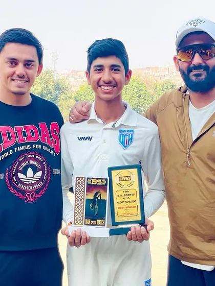 With the best batsman and another senior player. Proud of their achievements.