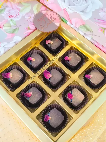 These are my rose-flavoured chocolate bonbons from the Rakhi collection. Each chocolate is delicately flavoured and decorated with a dried rose petal for an elegant touch.
