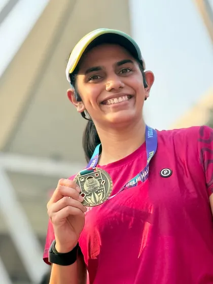 That post-race smile with the medal. Feeling re-energized for the week ahead after the Vedanta Delhi Half Marathon.