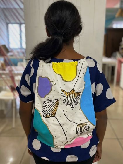 Another stylish, hand-painted backpack created by one of our talented participants.