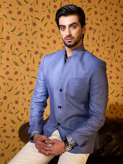 A guest looking sharp in a blue Irish linen jacket. The clean silhouette and comfortable fabric make it an ideal choice for a long day of wedding festivities.