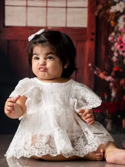 Even the cutest babies have their sassy moments. We capture all the expressions, from sweet smiles to funny faces, because it's all part of their unique personality.