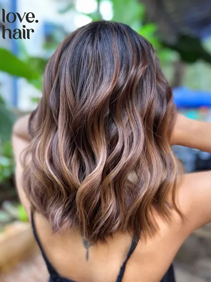A low-maintenance soft brunette balayage on a chic bob, designed for a seamless grow-out.