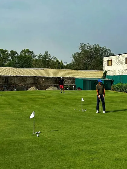 Our putting green features multiple holes, allowing several golfers to practice their strokes at the same time.