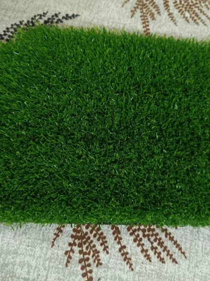 A clear, top-down view of a standard green artificial turf sample. This shows the typical texture and color blend you can expect for residential use.