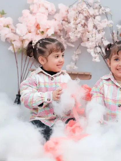 More playtime in the clouds for these adorable twins. Our goal is to make every photoshoot a fun and memorable experience.