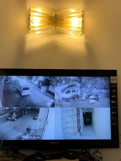 Night vision in action. This 4-camera view shows clear black and white footage of the street and parking area at night.