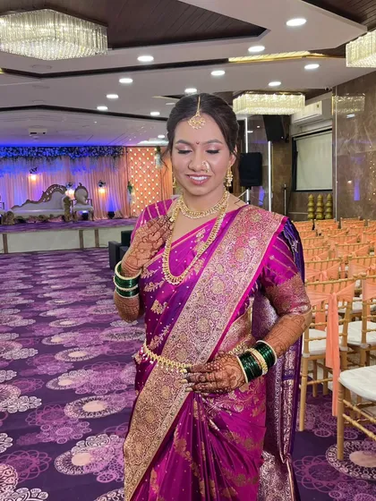This bride radiates pure grace in her vibrant purple saree. Her wedding look was crafted to be uniquely hers, blending timeless beauty with personal touches that reflect her calm and confident personality.