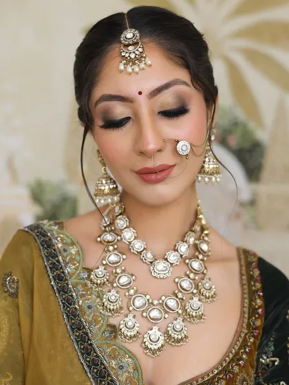 Another angle of this stunning bridal makeup, showcasing the precision and artistry involved.